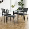 Modern simple table with a glass square table and four chairs. Transparent tempered glass countertop, black metal legs